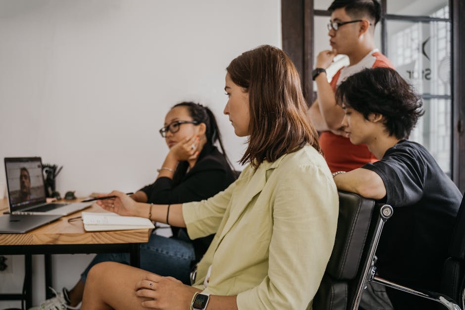 group of people in video call coaching session on laptops