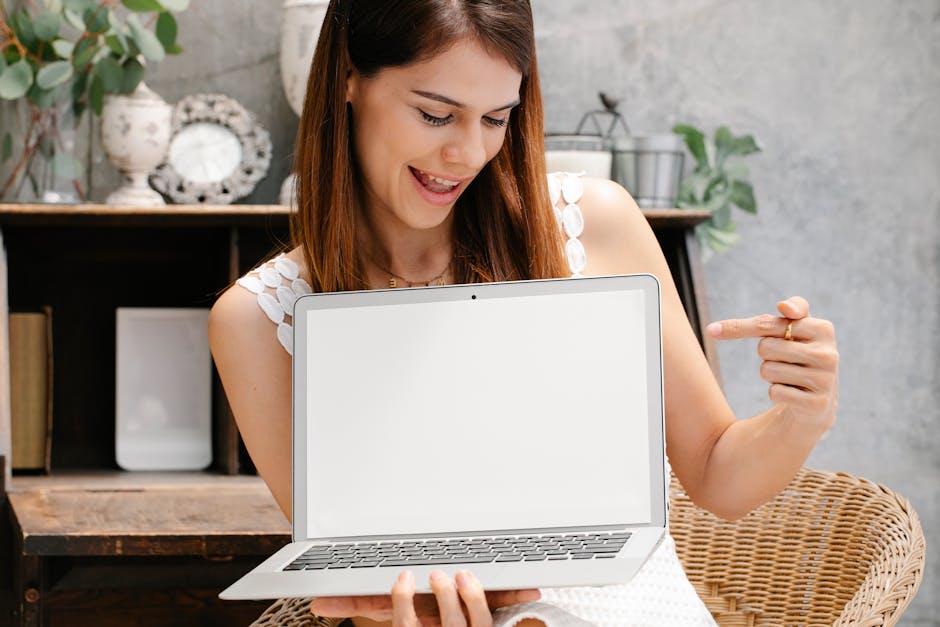 How to Sell Digital Products Without a Website in 2026: The Essential Guide 2 woman looking at laptop showing successful sale confirmation screen
