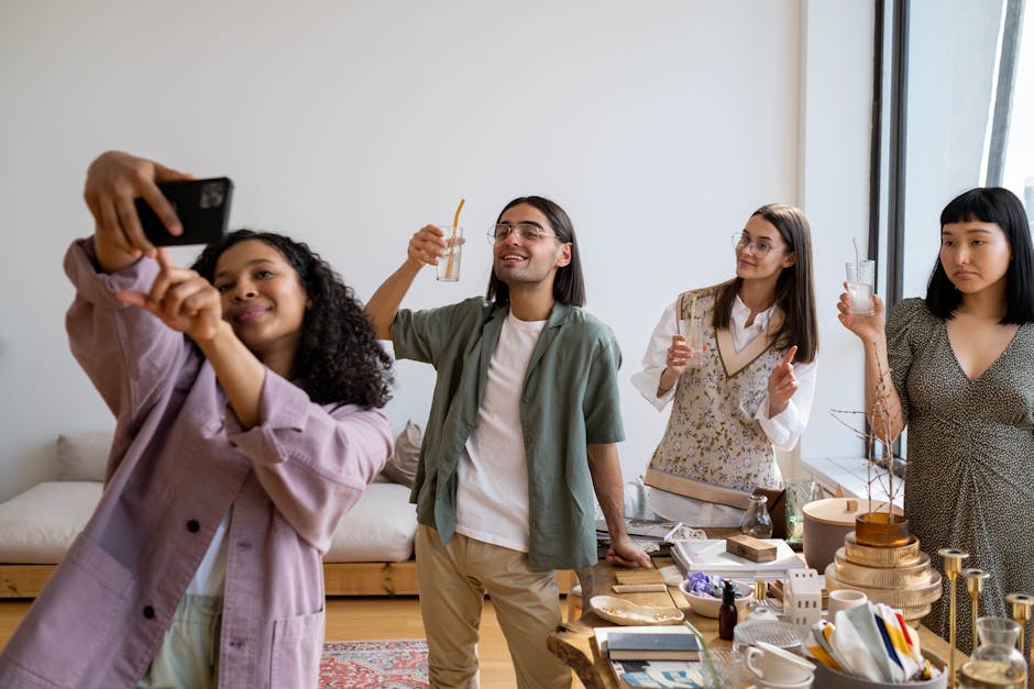 diverse group of coaches celebrating challenge launch results on their phones