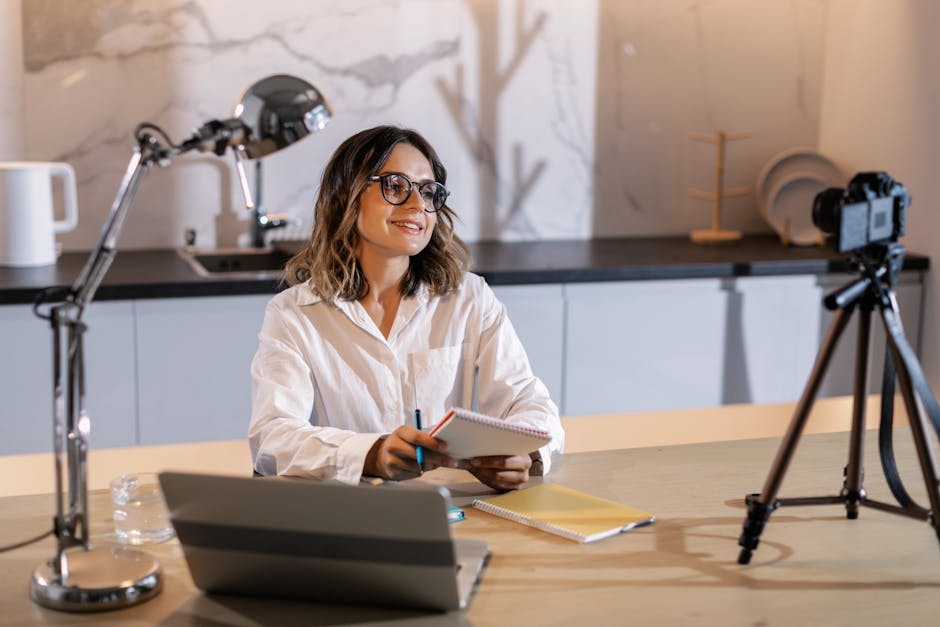 coach creating content for online challenge participants at home office desk