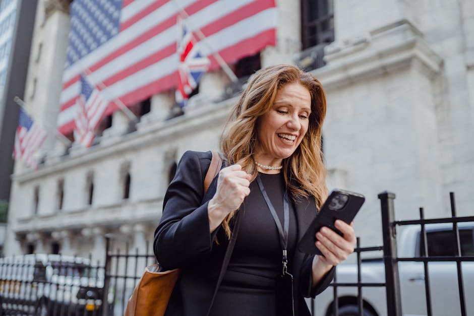 coach celebrating successful challenge launch looking at phone metrics - auto dm instagram coaches