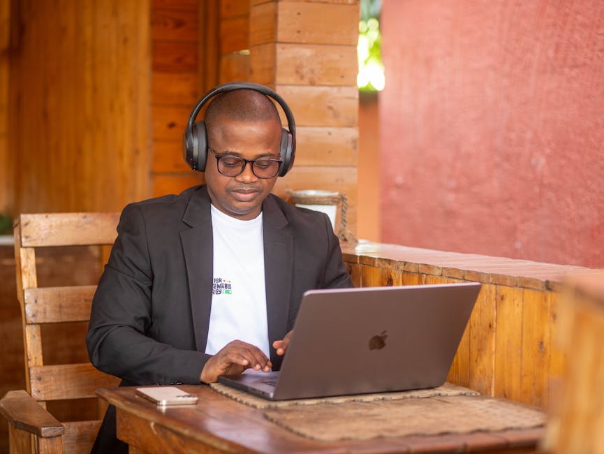 coach delivering online program on laptop with headphones
