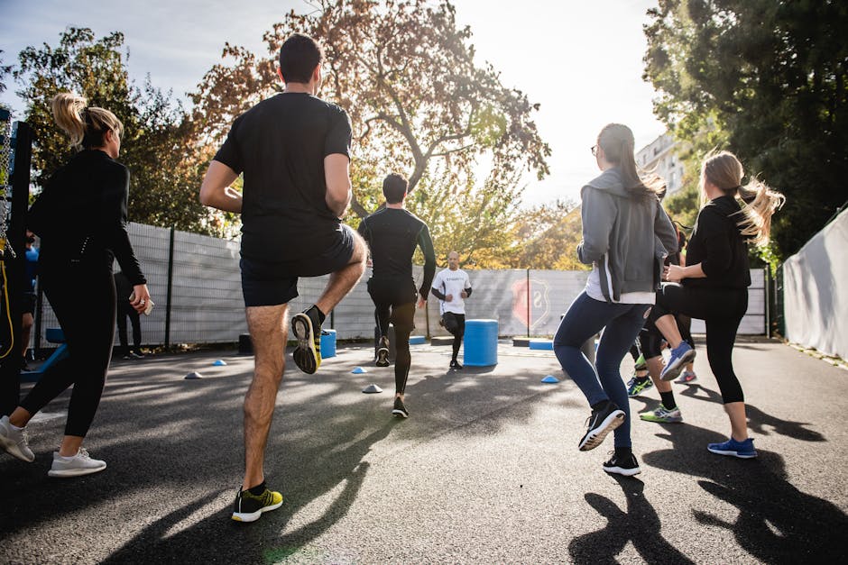 Fitness Influencer Passive Income in 2026: The 4-Layer Automated Revenue Stack 2 Active group participating in an outdoor fitness session in Boulogne-Billancourt, France.