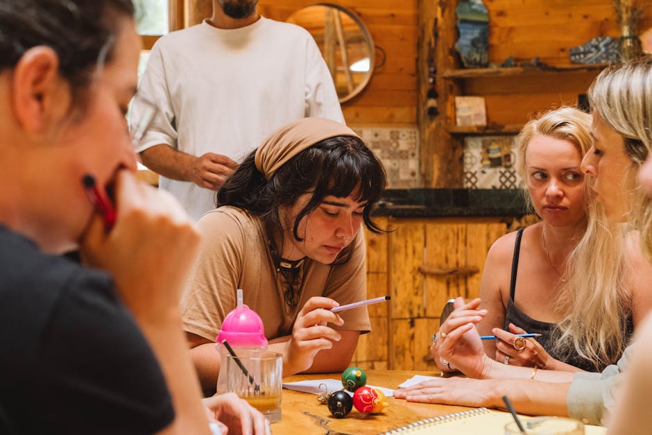 high-end business coaching session with small group around table